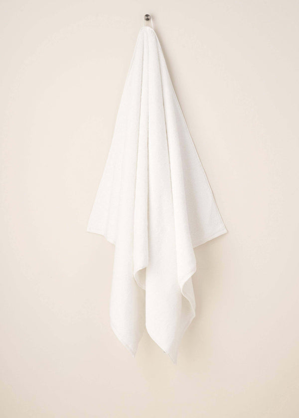 White Turkish Cotton Bath Towel Hanging Up | Truly Lifestyle