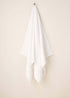 White Turkish Cotton Bath Towel Hanging Up | Truly Lifestyle