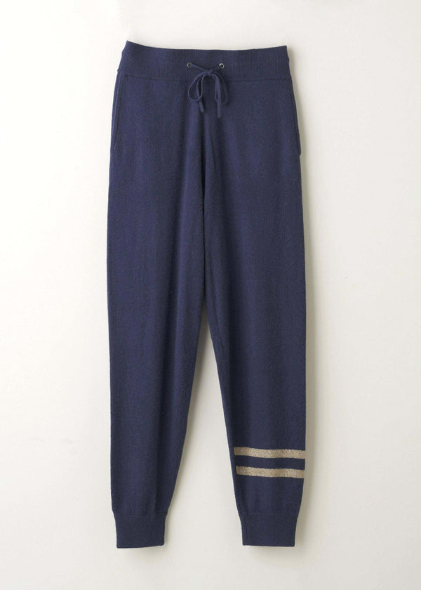 Navy Blue Yak Ladies Jogging Bottoms With Gold Detailing Hanging Up | Truly Lifestyle