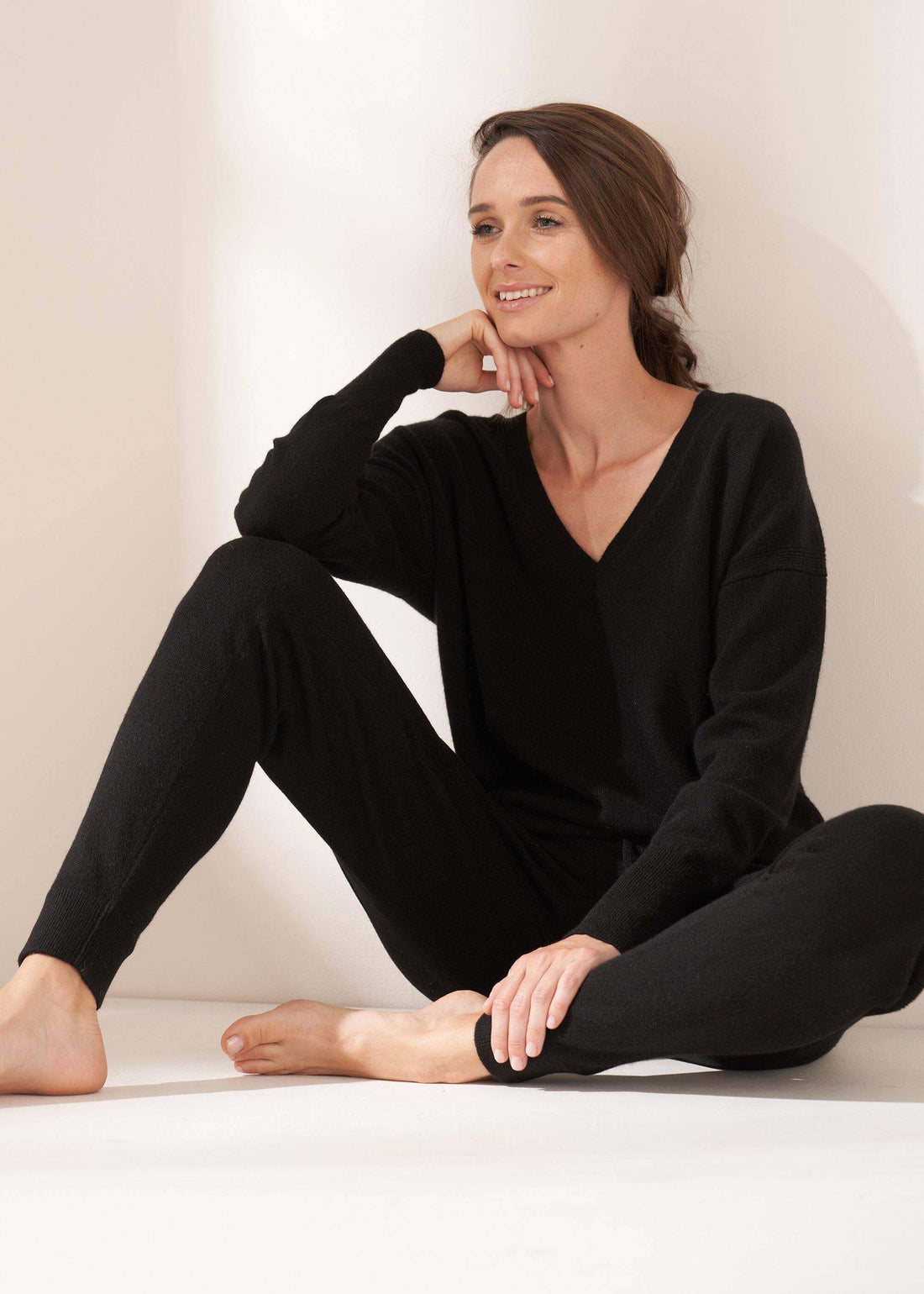 Womens Black V Neck Cashmere Jumper On Model Wearing Black Cashmere Jogging Bottoms | Truly Lifestyle