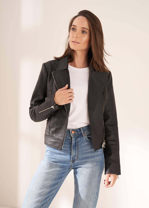 Womens Black Leather Biker Jacket On Model With Jeans And White Top| Truly Lifestyle