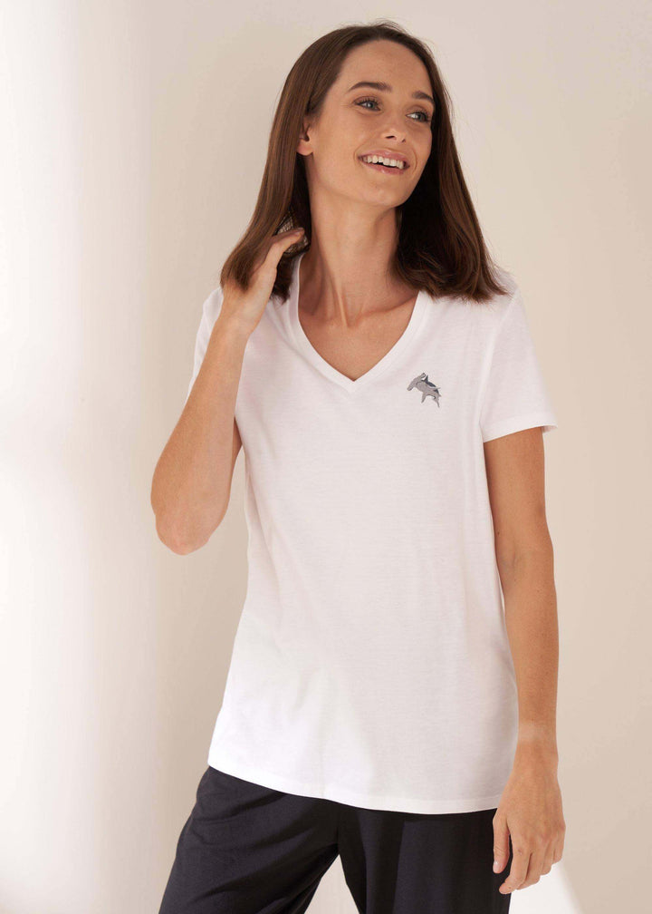 Womens White V Neck TShirt With Shark Logo On Model With Hareem Joggers | Truly Lifestyle
